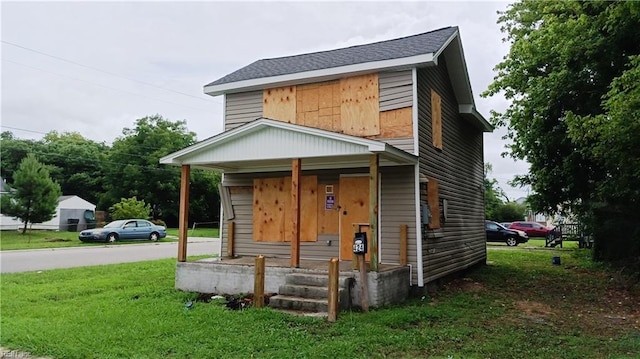 view of front facade with a porch and a front yard