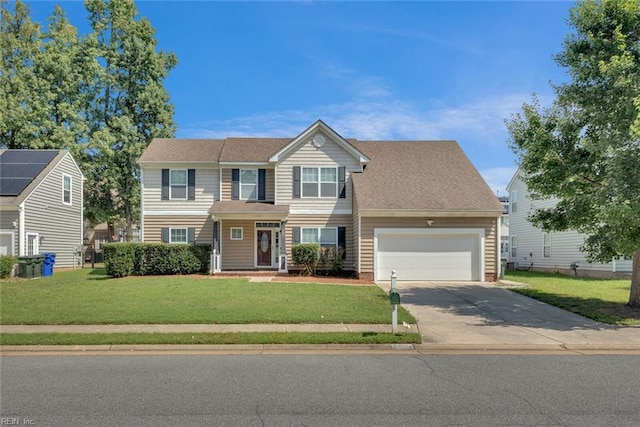 view of front of home with a garage and a front yard