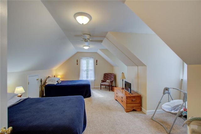 carpeted bedroom with lofted ceiling and ceiling fan