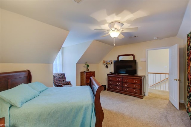 bedroom featuring ceiling fan, light carpet, and vaulted ceiling