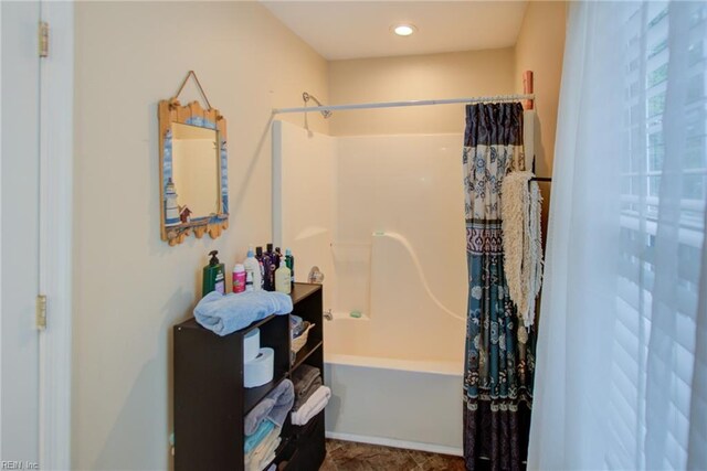 bathroom with vanity and shower / tub combo