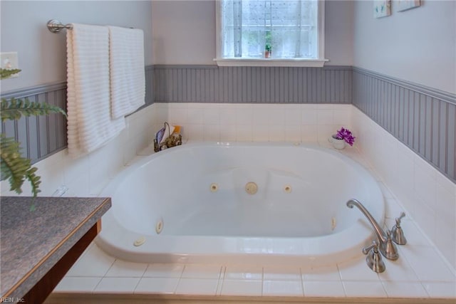 bathroom featuring a relaxing tiled tub