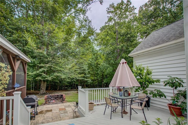 wooden deck with a patio