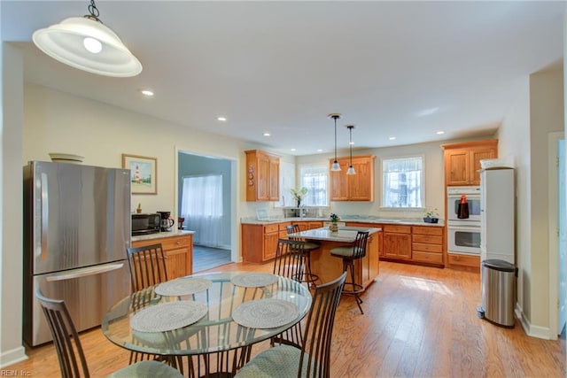 dining room featuring light hardwood / wood-style flooring