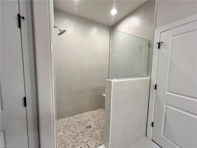 bathroom with tiled shower