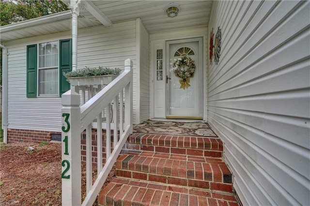 entrance to property with covered porch