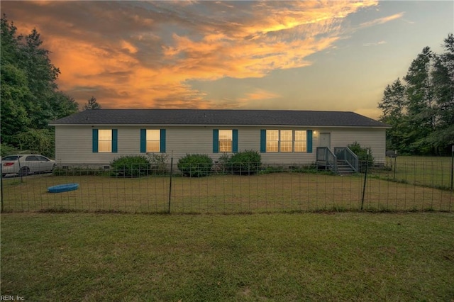 view of front of house featuring a front yard, fence, and crawl space