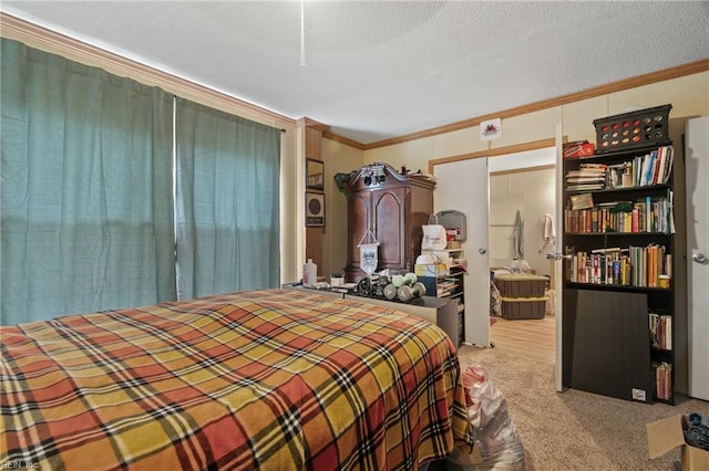 carpeted bedroom with a textured ceiling and crown molding