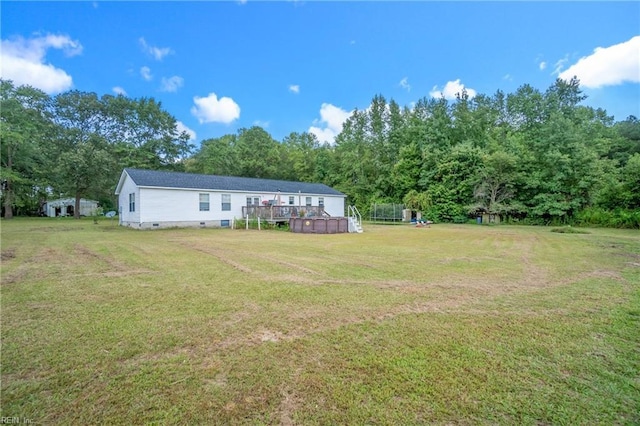 view of yard featuring a wooden deck