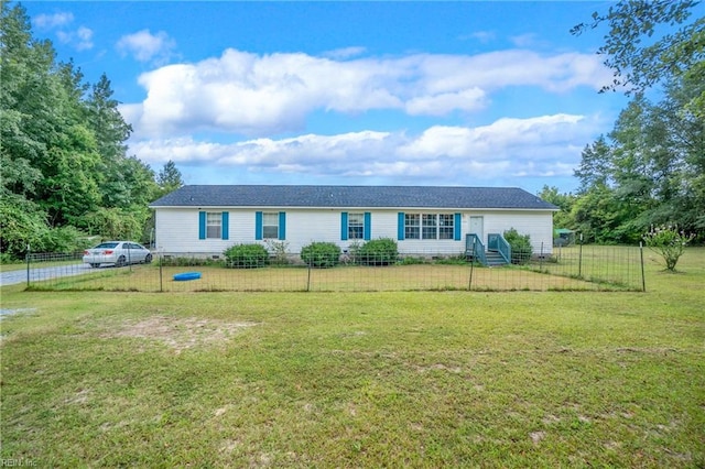 ranch-style home featuring crawl space, a fenced front yard, and a front lawn