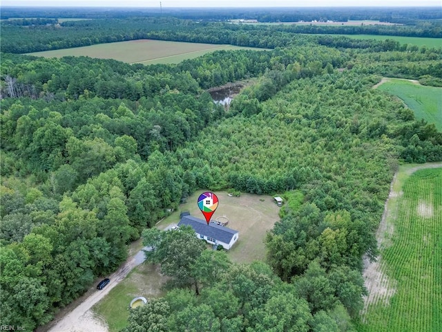 drone / aerial view featuring a view of trees