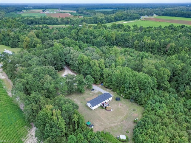 birds eye view of property featuring a rural view and a forest view