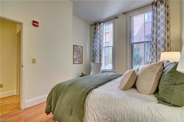 bedroom with light wood-type flooring