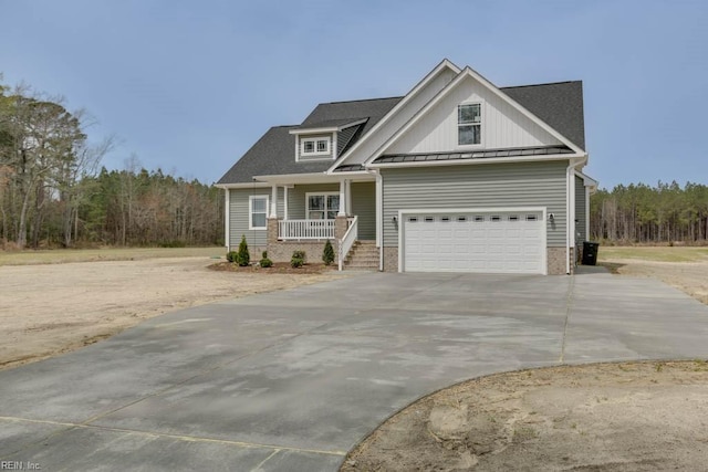 view of front of property featuring a garage and a porch