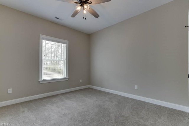 unfurnished room with light carpet and ceiling fan