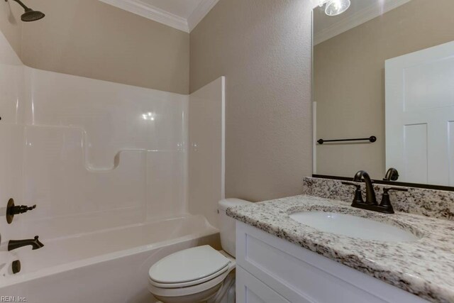 full bathroom featuring ornamental molding, vanity, toilet, and shower / washtub combination