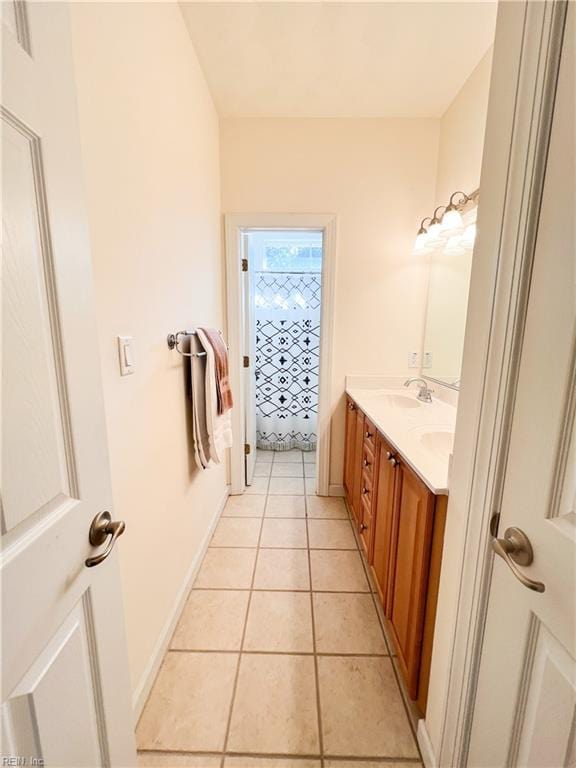 bathroom with vanity and tile patterned flooring