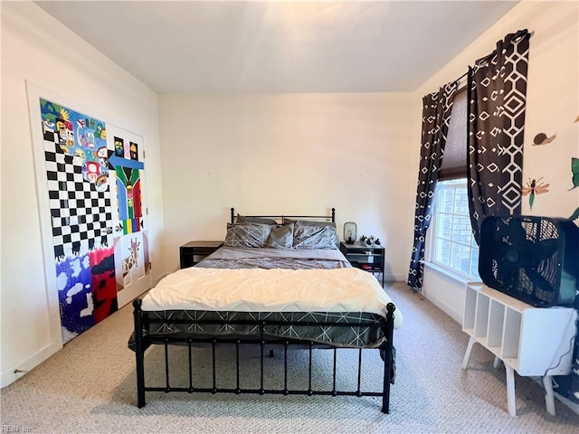 bedroom with light carpet