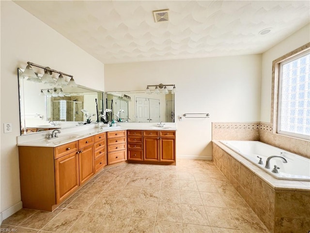 bathroom with separate shower and tub and vanity