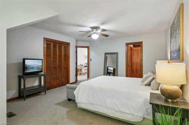 bedroom with ceiling fan, a closet, and carpet floors