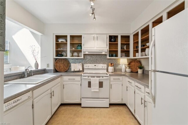 kitchen with white cabinetry, white appliances, sink, and tasteful backsplash