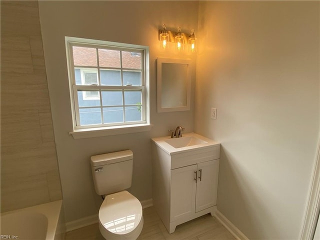 full bathroom featuring vanity, shower with separate bathtub, and toilet