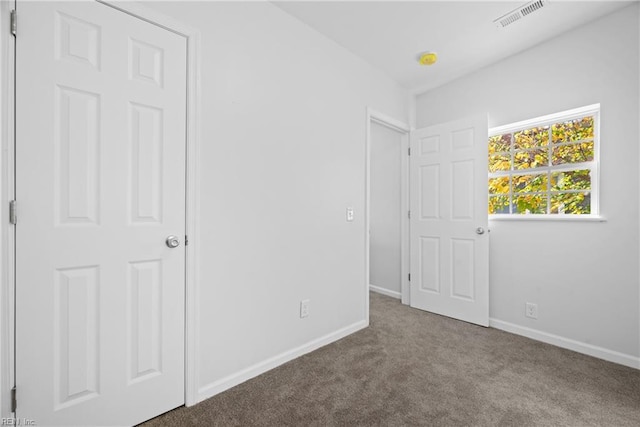 unfurnished bedroom with carpet flooring