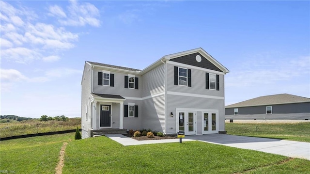 view of front facade featuring a front lawn and french doors