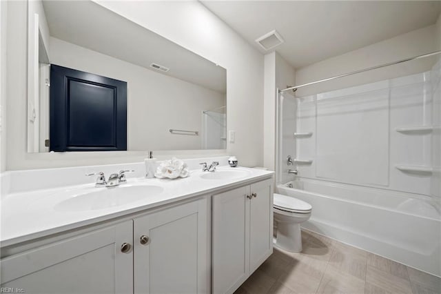 full bathroom with vanity, shower / bathtub combination, and toilet