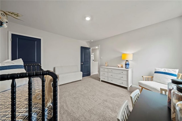 bedroom featuring light carpet