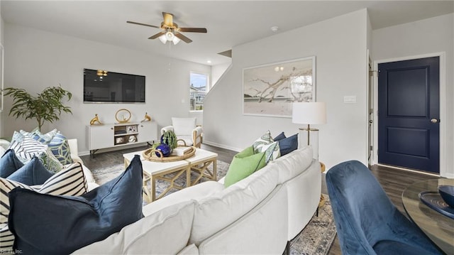 living room featuring dark hardwood / wood-style floors and ceiling fan