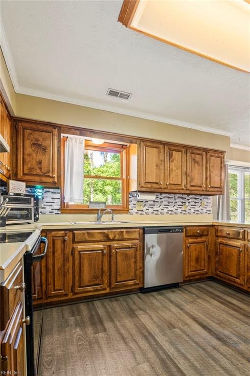 kitchen featuring light countertops, visible vents, dishwasher, black range with electric stovetop, and brown cabinetry