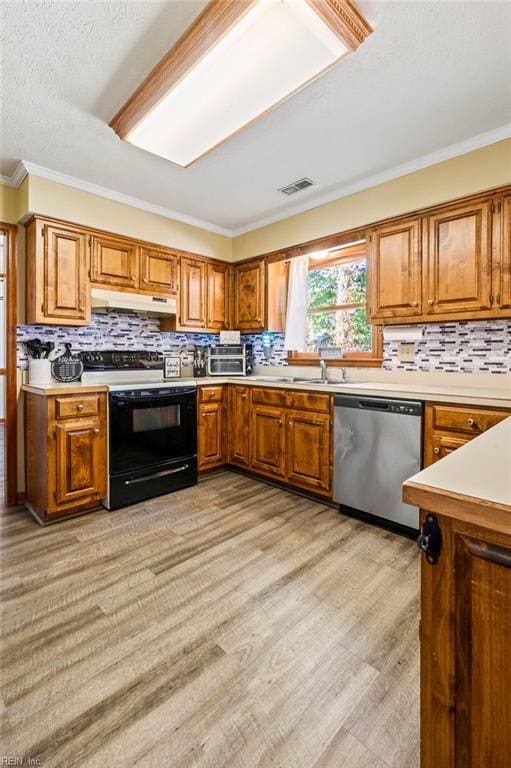 kitchen featuring light wood finished floors, black range with electric cooktop, dishwasher, brown cabinetry, and under cabinet range hood