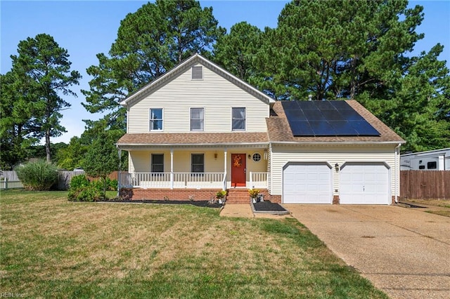 traditional-style house featuring driveway, an attached garage, a front lawn, solar panels, and a porch