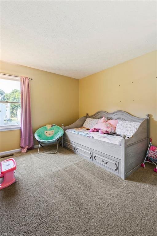 carpeted bedroom with a textured ceiling