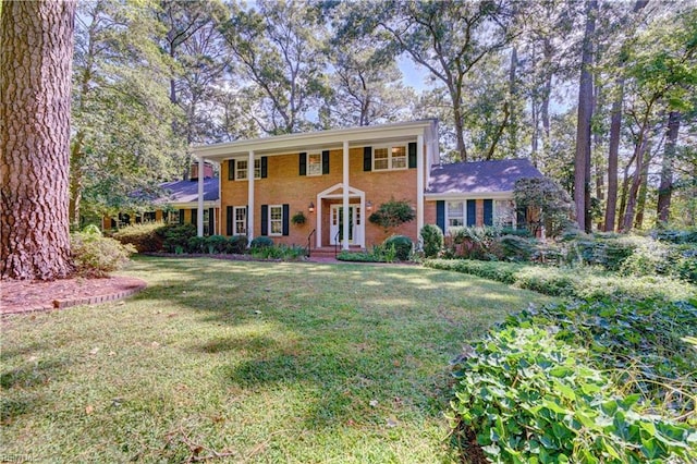 colonial home with a front lawn