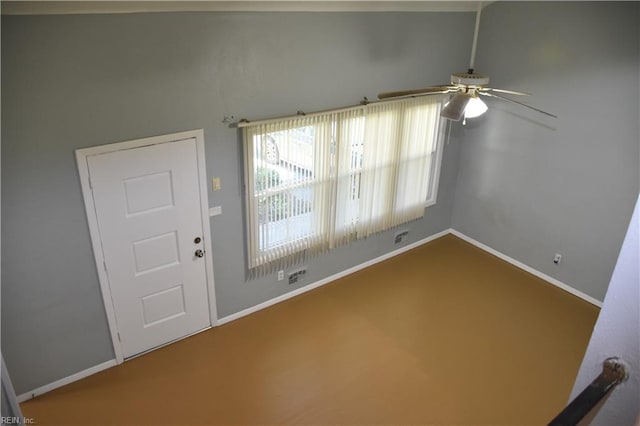 interior space with ceiling fan