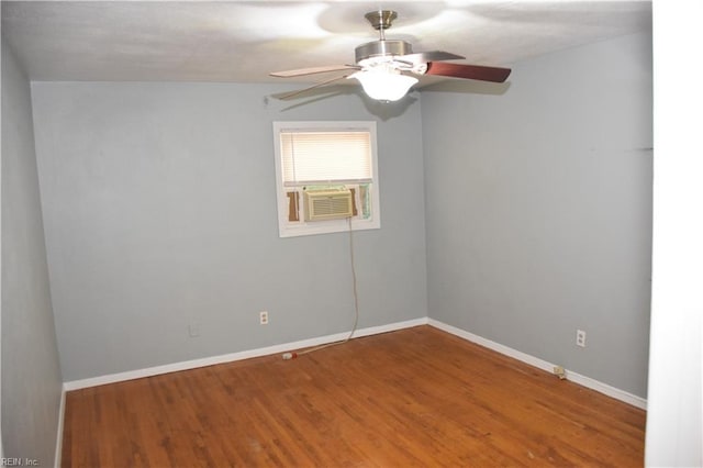 spare room with ceiling fan and hardwood / wood-style flooring