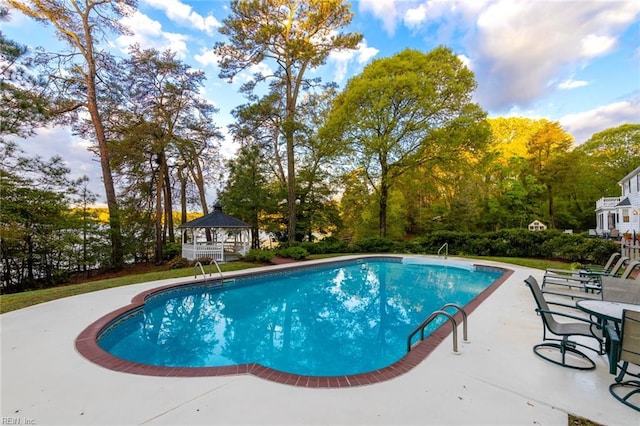 view of pool with a patio area and a gazebo