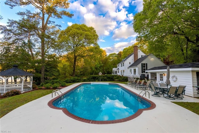 8429 Denwood Rd, Franktown, VA 23354 - swimming pool with a gazebo, a patio area, and view of scattered trees