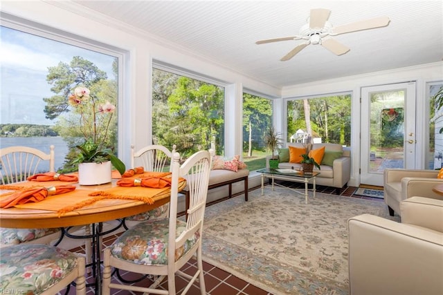 sunroom featuring ceiling fan