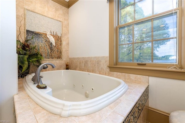 bathroom featuring tiled tub