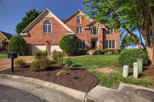 view of front of property featuring a front lawn and a garage