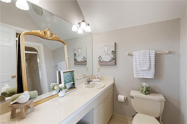 bathroom featuring vanity, toilet, vaulted ceiling, and a shower with shower door