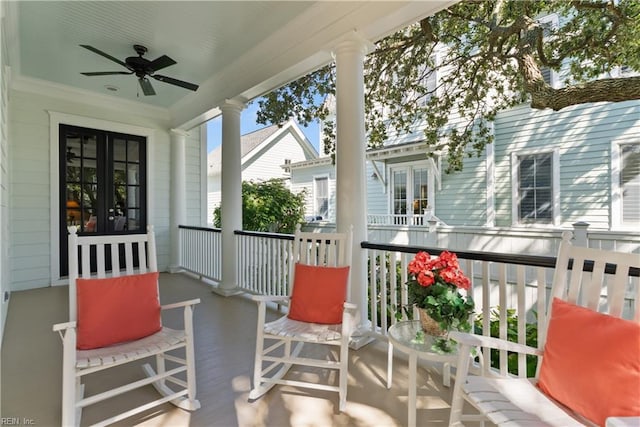 balcony featuring a porch and ceiling fan