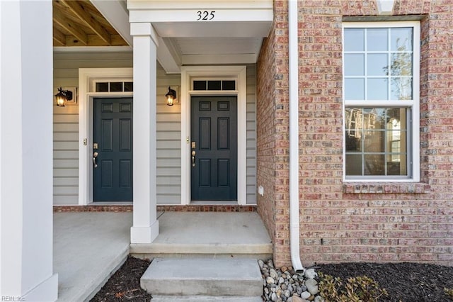 entrance to property with covered porch