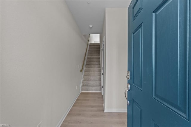 foyer entrance with light hardwood / wood-style flooring