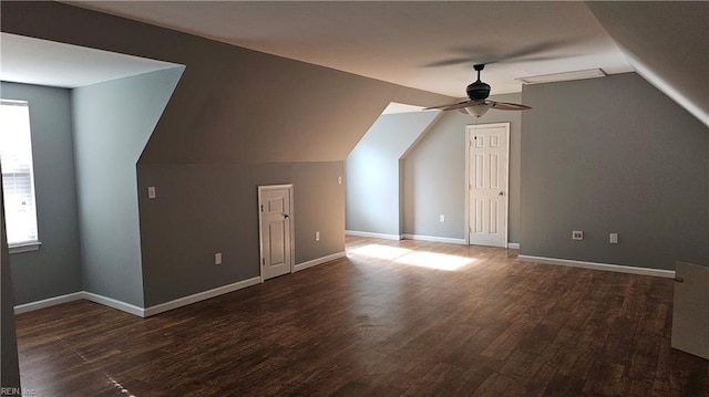 additional living space featuring ceiling fan, lofted ceiling, and dark wood-type flooring