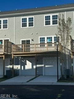 rear view of house with a wooden deck