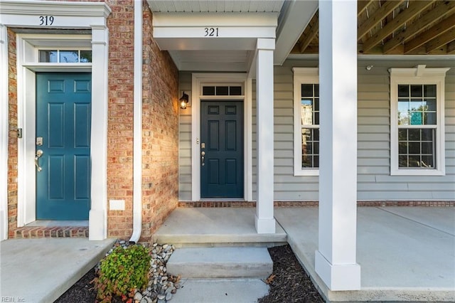 entrance to property featuring a porch